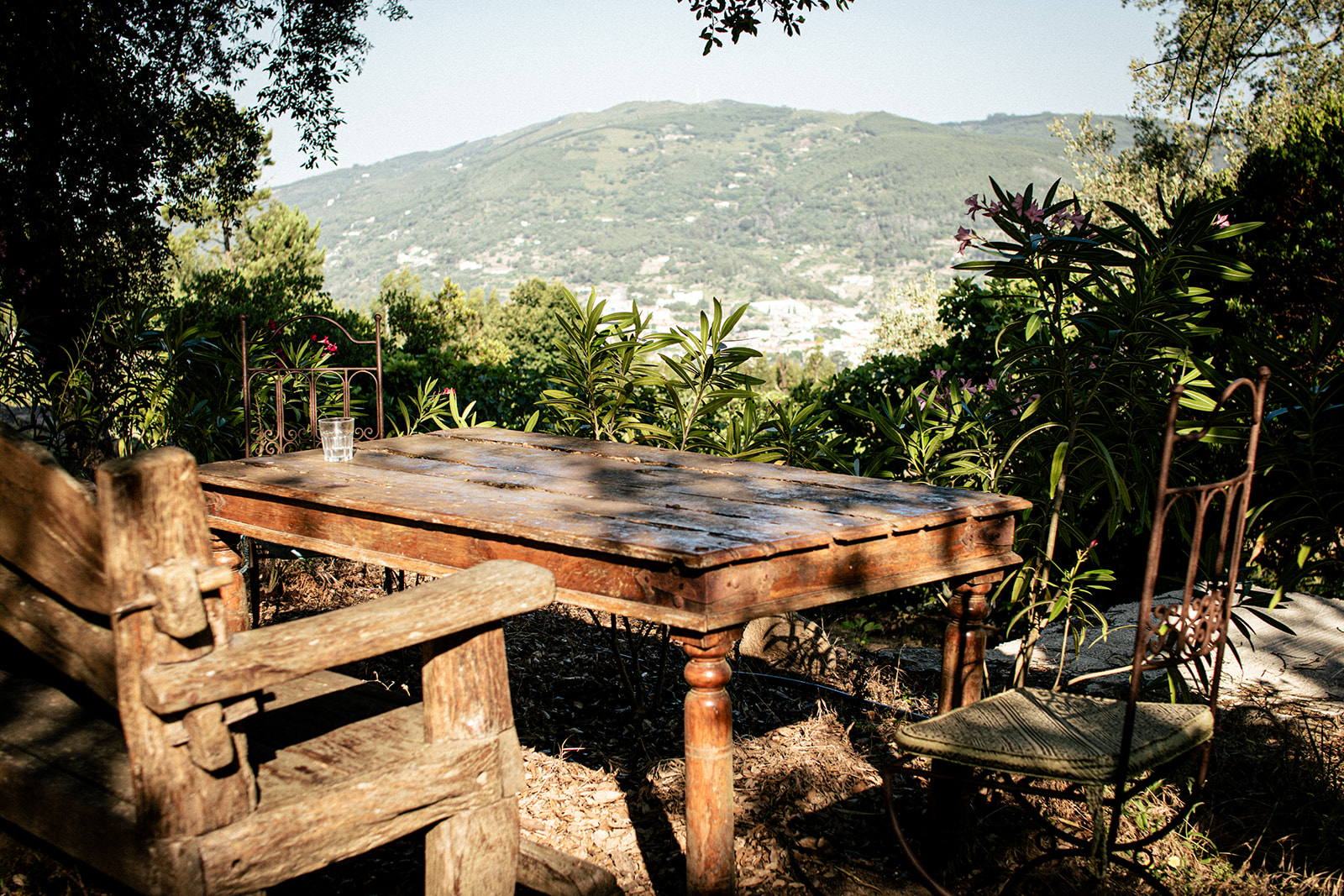 Outdoor dining table overlooking the valley at Bodhi Bhavan